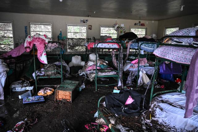 TOPSHOT - A view inside of a cabin at Camp Mystic, the site of where at least 20 girls went missing after flash flooding in Hunt, Texas, on July 5, 2025. Rescuers were on Saturday searching for more than 20 girls missing from a riverside summer camp in the US state of Texas, after torrential rains caused devastating flooding that killed at least 27 people -- with more rain on the way. "So far, we've evacuated over 850 uninjured people, eight injured people and have recovered 27 deceased fatalities at this time. Of these 27, 18 are adults, nine are children," said Kerr Country Sheriff Larry Leitha on July 5. (Photo by RONALDO SCHEMIDT / AFP)