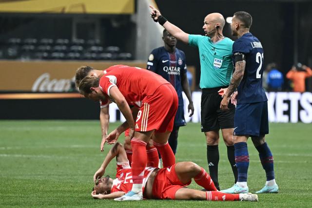 Bayern Munich's Portuguese defender #22 Raphael Guerreiro reacts on the ground during the FIFA Club World Cup 2025 quarterfinal football match between France's Paris Saint-Germain and Germany's Bayern Munich at the Mercedes-Benz Stadium in Atlanta on July 5, 2025. (Photo by Paul ELLIS / AFP)