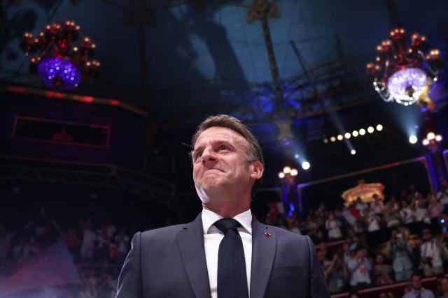 France's President Emmanuel arrives to attend a rally marking the 10th anniversary of "Les Jeunes avec Macron" (Youth with Macron), the youth movement of the Renaissance party, at the Cirque d'Hiver in Paris on July 5, 2025. (Photo by Sebastien DUPUY / AFP)