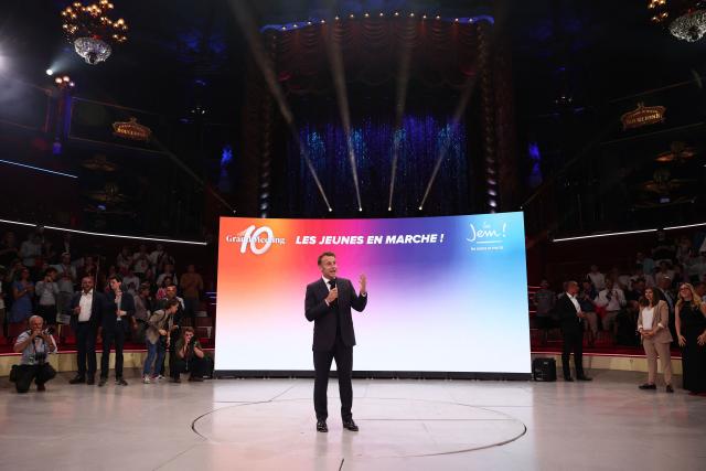 France's President Emmanuel delivers a speech during a rally marking the 10th anniversary of "Les Jeunes avec Macron" (Youth with Macron), the youth movement of the Renaissance party, at the Cirque d'Hiver in Paris on July 5, 2025. (Photo by Sebastien DUPUY / AFP)