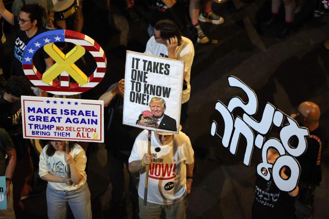 Demonstrators gather during an anti-government protest calling for action to secure the release of Israeli hostages held captive in the Gaza Strip by Palestinian militants since the 2023 October 7 attacks, outside the Israeli Defence Ministry headquarters in Tel Aviv on July 5, 2025. (Photo by Jack GUEZ / AFP)