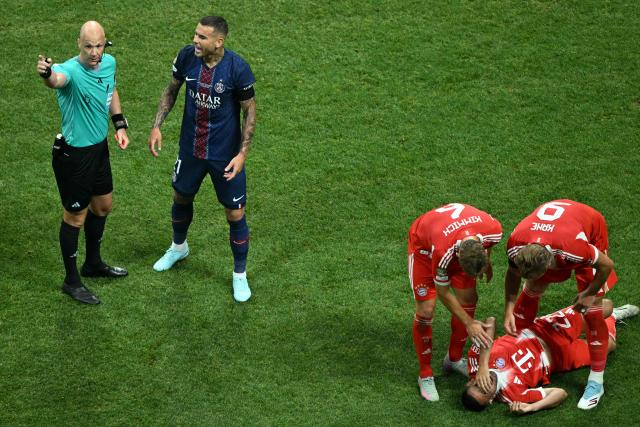 Bayern Munich's Portuguese defender #22 Raphael Guerreiro reacts on the ground during the FIFA Club World Cup 2025 quarterfinal football match between France's Paris Saint-Germain and Germany's Bayern Munich at the Mercedes-Benz Stadium in Atlanta on July 5, 2025. (Photo by ROBERTO SCHMIDT / AFP)