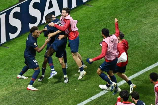 Paris Saint-Germain's French forward #10 Ousmane Dembele (C) celebrates with teammates after scoring his team's second goal during the FIFA Club World Cup 2025 quarterfinal football match between France's Paris Saint-Germain and Germany's Bayern Munich at the Mercedes-Benz Stadium in Atlanta on July 5, 2025. (Photo by ROBERTO SCHMIDT / AFP)