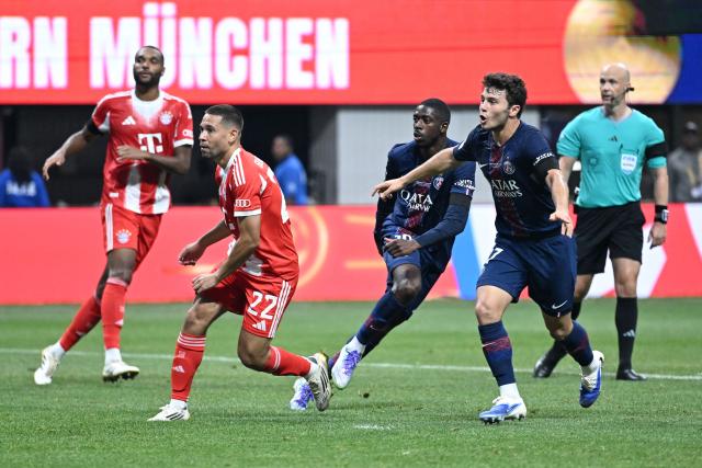 Paris Saint-Germain's French forward #10 Ousmane Dembele (2-R) celebrates scoring his team's second goal with Portuguese midfielder #87 Joao Pedro Goncalves Neves during the FIFA Club World Cup 2025 quarterfinal football match between France's Paris Saint-Germain and Germany's Bayern Munich at the Mercedes-Benz Stadium in Atlanta on July 5, 2025. (Photo by PATRICIA DE MELO MOREIRA / AFP)