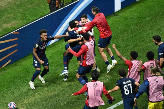 Paris Saint-Germain's French forward #10 Ousmane Dembele (C) celebrates with teammates after scoring his team's second goal during the FIFA Club World Cup 2025 quarterfinal football match between France's Paris Saint-Germain and Germany's Bayern Munich at the Mercedes-Benz Stadium in Atlanta on July 5, 2025. (Photo by ROBERTO SCHMIDT / AFP)