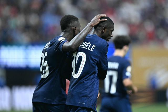 Paris Saint-Germain's French forward #10 Ousmane Dembele (R) celebrates scoring his team's second goal during the FIFA Club World Cup 2025 quarterfinal football match between France's Paris Saint-Germain and Germany's Bayern Munich at the Mercedes-Benz Stadium in Atlanta on July 5, 2025. (Photo by PATRICIA DE MELO MOREIRA / AFP)