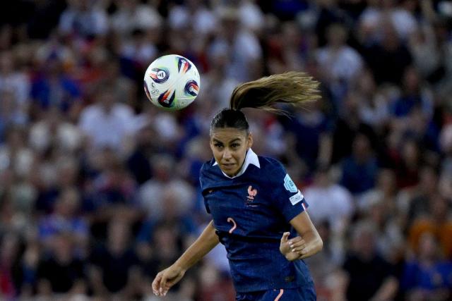 France's defender #02 Maelle Lakrar heads the ball during the UEFA Women's Euro 2025 Group D football match between France and England at the Letzigrund Stadium in Zurich, on July 5, 2025. (Photo by Miguel MEDINA / AFP)