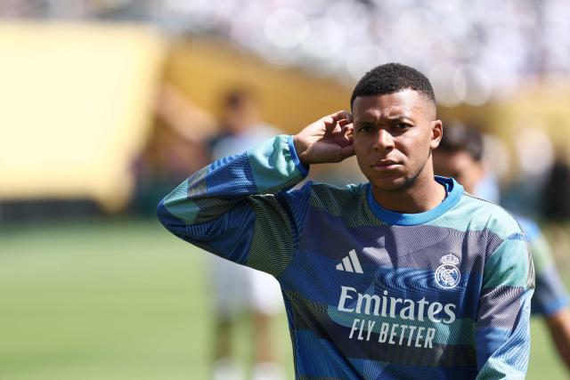 Real Madrid's French forward #09 Kylian Mbappe looks on during a warmup ahead of the FIFA Club World Cup 2025 quarterfinal football match between Spain's Real Madrid and Germany's Borussia Dortmund at the MetLife stadium in East Rutherford, New Jersey on July 05, 2025. (Photo by FRANCK FIFE / AFP)