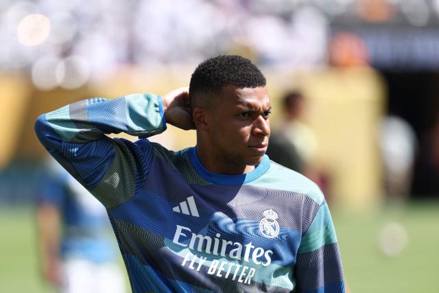Real Madrid's French forward #09 Kylian Mbappe warms up ahead of the FIFA Club World Cup 2025 quarterfinal football match between Spain's Real Madrid and Germany's Borussia Dortmund at the MetLife stadium in East Rutherford, New Jersey on July 05, 2025. (Photo by FRANCK FIFE / AFP)