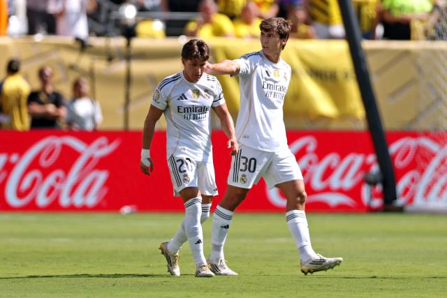Real Madrid's Spanish forward #30 Gonzalo Garcia celebrates scoring his team's first goal alongside Real Madrid's Spanish defender #20 Francisco Garcia during the FIFA Club World Cup 2025 quarterfinal football match between Spain's Real Madrid and Germany's Borussia Dortmund at the MetLife stadium in East Rutherford, New Jersey on July 5, 2025. (Photo by CHARLY TRIBALLEAU / AFP)
