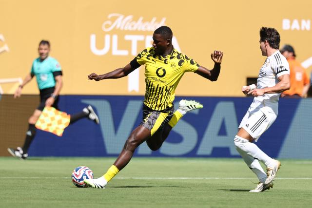 Borussia Dortmund's Guinean forward #09 Serhou Guirassy and Real Madrid's Spanish defender #20 Francisco Garcia fight for the ball during the FIFA Club World Cup 2025 quarterfinal football match between Spain's Real Madrid and Germany's Borussia Dortmund at the MetLife stadium in East Rutherford, New Jersey on July 05, 2025. (Photo by Franck FIFE / AFP)