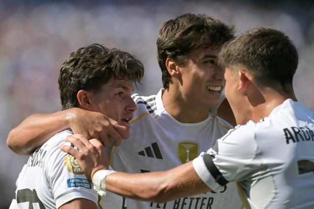 Real Madrid's Spanish defender #20 Francisco Garcia (L) celebrates with teammates Spanish forward #30 Gonzalo Garcia (C) and Turkish midfielder #15 Arda Guler (R) after scoring his team's second goal during the FIFA Club World Cup 2025 quarterfinal football match between Spain's Real Madrid and Germany's Borussia Dortmund at the MetLife stadium in East Rutherford, New Jersey on July 05, 2025. (Photo by JUAN MABROMATA / AFP)