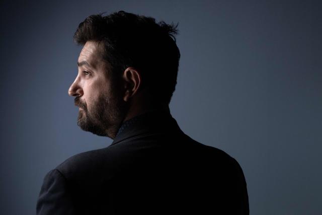 (FILES) Portuguese theatre actor, director, dramaturge and director of the Festival d'Avignon Tiago Rodrigues, poses during a photo session in Paris on September 15, 2022. “How will younger generations hold on to the idea of changing the world for the better?” asks Tiago Rodrigues, director of the Avignon Festival, in La distance, a dystopia set in 2077, when life on Earth has become increasingly difficult. (Photo by Joлl SAGET / AFP)