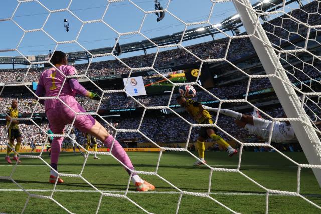 Real Madrid's French forward #09 Kylian Mbappe scores his team's third goal during the FIFA Club World Cup 2025 quarterfinal football match between Spain's Real Madrid and Germany's Borussia Dortmund at the MetLife stadium in East Rutherford, New Jersey on July 05, 2025. (Photo by Franck FIFE / AFP)
