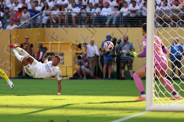 Real Madrid's French forward #09 Kylian Mbappe scores his team's third goal during the FIFA Club World Cup 2025 quarterfinal football match between Spain's Real Madrid and Germany's Borussia Dortmund at the MetLife stadium in East Rutherford, New Jersey on July 5, 2025. (Photo by CHARLY TRIBALLEAU / AFP)