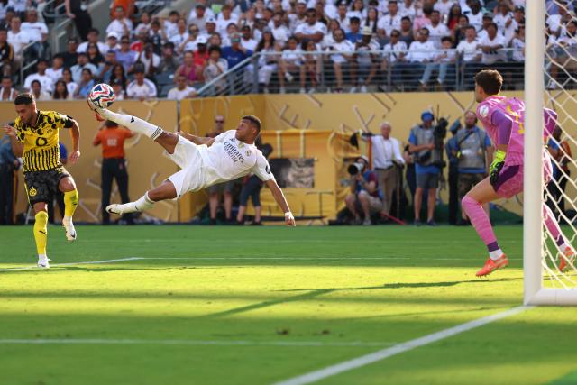 Real Madrid's French forward #09 Kylian Mbappe scores his team's third goal during the FIFA Club World Cup 2025 quarterfinal football match between Spain's Real Madrid and Germany's Borussia Dortmund at the MetLife stadium in East Rutherford, New Jersey on July 5, 2025. (Photo by CHARLY TRIBALLEAU / AFP)