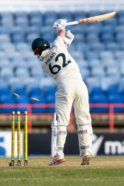 Travis Head of Australia is bowled out by Shamar Joseph of West Indies during the 3rd day of the 2nd Test match between West Indies and Australia at Grenada National Cricket Stadium, Saint George's, Grenada, on July 5, 2025. (Photo by Randy Brooks / AFP)