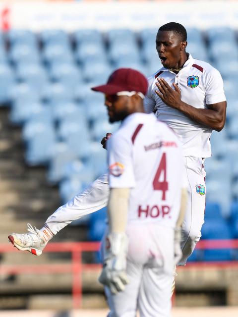 Shamar Joseph (R) of West Indies celebrates the dismissal of Travis Head of Australia  during the 3rd day of the 2nd Test match between West Indies and Australia at Grenada National Cricket Stadium, Saint George's, Grenada, on July 5, 2025. (Photo by Randy Brooks / AFP)
