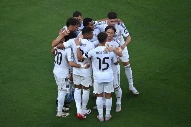 Real Madrid's French forward #09 Kylian Mbappe (C) celebrates with teammates after scoring his team's third goal during the FIFA Club World Cup 2025 quarterfinal football match between Spain's Real Madrid and Germany's Borussia Dortmund at the MetLife stadium in East Rutherford, New Jersey on July 05, 2025. (Photo by ANGELA WEISS / AFP)