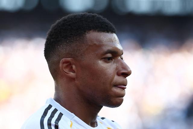 Real Madrid's French forward #09 Kylian Mbappe reacts after scoring his team's third goal during the FIFA Club World Cup 2025 quarterfinal football match between Spain's Real Madrid and Germany's Borussia Dortmund at the MetLife stadium in East Rutherford, New Jersey on July 05, 2025. (Photo by FRANCK FIFE / AFP)