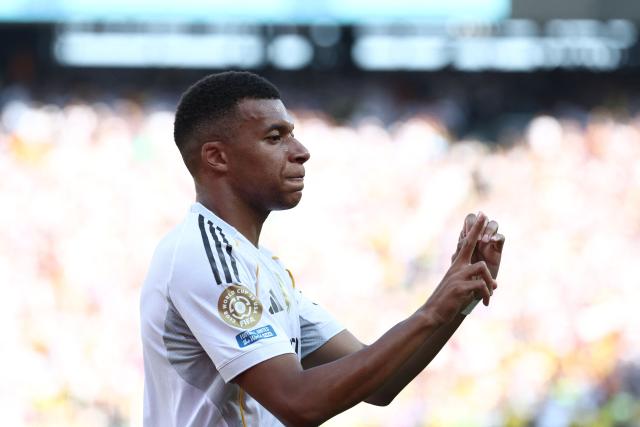 Real Madrid's French forward #09 Kylian Mbappe celebrates scoring his team's third goal during the FIFA Club World Cup 2025 quarterfinal football match between Spain's Real Madrid and Germany's Borussia Dortmund at the MetLife stadium in East Rutherford, New Jersey on July 05, 2025. (Photo by FRANCK FIFE / AFP)