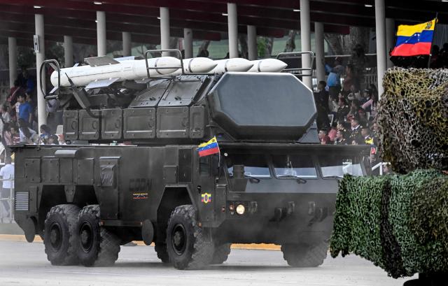 A Venezuelan Army truck carrying Russian missile launchers takes part in a military parade during celebrations for the Independence Day, in Caracas on July 5, 2025. (Photo by Juan BARRETO / AFP)