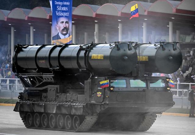 A Venezuelan Army truck carrying Russian missile launchers takes part in a military parade during celebrations for the Independence Day, in Caracas on July 5, 2025. (Photo by Juan BARRETO / AFP)