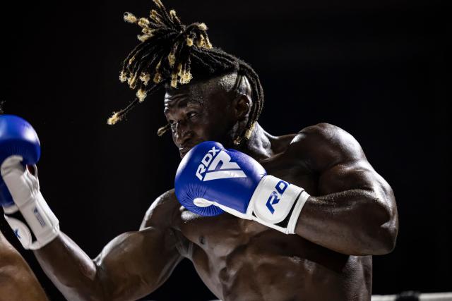 Senegalese kickboxer and World Champion Mouhamed Tafsir Ba competes against Swiss kickboxer Eric Brito (unseen) during their fight for the World Association of Kickboxing Organizations (WAKO) pro Intercontinental Belt in the 86kg category at the Grand Theater in Dakar, on July 6, 2025. (Photo by PATRICK MEINHARDT / AFP)