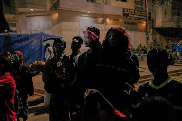 Men and women in costume parade in the street as part of the Tamkharite celebration in Grand Dakar, Senegal, on July 5, 2025. In Senegal, a predominantly Sunni Muslim country, Ashura is celebrated as Tamkharite, blending religion and local culture. Religiously, it commemorates the day Allah saved Prophet Moses (Moussa), and many Sunni Muslims fast in gratitude.Families prepare special millet couscous, and children celebrate Tajabone, dressing up and singing for treats. (Photo by Carmen Abd Ali / AFP)