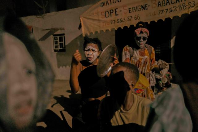Women and children in costume parade in the street as part of the Tamkharite celebration in Medina, Dakar, Senegal, on July 5, 2025. In Senegal, a predominantly Sunni Muslim country, Ashura is celebrated as Tamkharite, blending religion and local culture. Religiously, it commemorates the day Allah saved Prophet Moses (Moussa), and many Sunni Muslims fast in gratitude.Families prepare special millet couscous, and children celebrate Tajabone, dressing up and singing for treats. (Photo by Carmen Abd Ali / AFP)