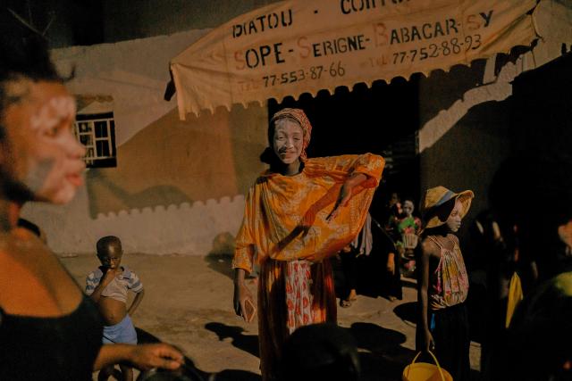 A child in costume parades in the street as part of the Tamkharite celebration in Medina, Dakar, Senegal, on July 5, 2025. In Senegal, a predominantly Sunni Muslim country, Ashura is celebrated as Tamkharite, blending religion and local culture. Religiously, it commemorates the day Allah saved Prophet Moses (Moussa), and many Sunni Muslims fast in gratitude.Families prepare special millet couscous, and children celebrate Tajabone, dressing up and singing for treats. (Photo by Carmen Abd Ali / AFP)