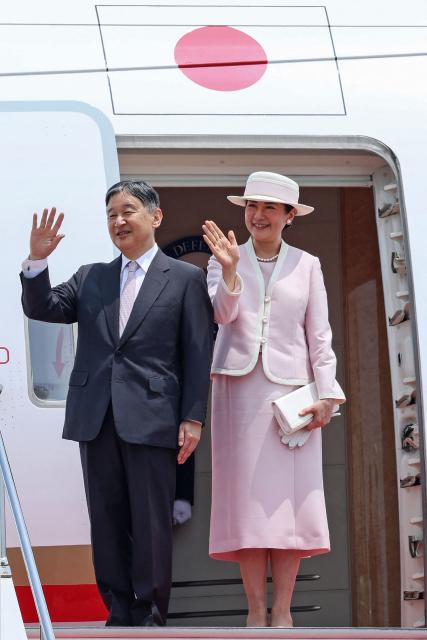 Japan's Emperor Naruhito (L) and Empress Masako wave ahead of their departure for a visit to Mongolia, at Tokyo International Airport at Haneda on July 6, 2025. (Photo by JIJI Press / AFP) / Japan OUT