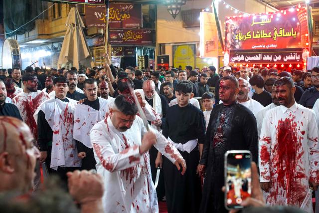 Shiite Muslim men take part in the Tatbir bloodletting ritual, an act of mourning marking Ashura, a 10-day period commemorating the seventh century killing of Prophet Mohammed's grandson Imam Hussein, in Iraq's central holy city of Najaf on July 5, 2025. (Photo by Qassem al-KAABI / AFP)