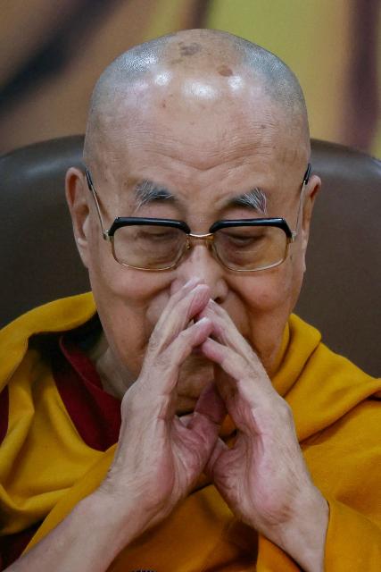 Tibetan spiritual leader the Dalai Lama attends a prayer ceremony celebrating his 90th birth anniversary at the Main Tibetan Temple in McLeod Ganj, near Dharamsala, on July 6, 2025. Calling himself a "simple Buddhist monk" who usually didn't celebrate birthdays, the Dalai Lama marked his 90th on July 6 by praying for peace after China insisted it would have final say on who succeeded the Tibetan spiritual leader. (Photo by Niharika KULKARNI / AFP)