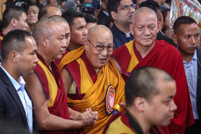 Tibetan spiritual leader the Dalai Lama (C) attends a prayer ceremony celebrating his 90th birth anniversary at the Main Tibetan Temple in McLeod Ganj, near Dharamsala, on July 6, 2025. Calling himself a "simple Buddhist monk" who usually didn't celebrate birthdays, the Dalai Lama marked his 90th on July 6 by praying for peace after China insisted it would have final say on who succeeded the Tibetan spiritual leader. (Photo by Sanjay BAID / AFP)