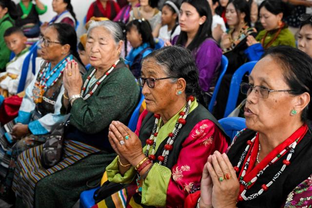 Exiled Tibetans offer prayers to celebrate the 90th birthday of their spiritual leader the Dalai Lama, at a Tibetan refugee camp in the Jawalakhel area of Lalitpur, on the outskirts of Kathmandu on July 6, 2025. Calling himself a "simple Buddhist monk" who usually doesn't celebrate birthdays, the Dalai Lama marked his 90th on July 6, by praying for peace after China insisted it would have the final say on who succeeded the Tibetan spiritual leader. (Photo by Prakash MATHEMA / AFP)
