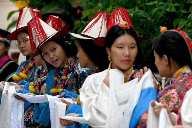 Exiled Tibetans take part in a procession to celebrate the 90th birthday of their spiritual leader the Dalai Lama, at a Tibetan refugee camp in the Jawalakhel area of Lalitpur, on the outskirts of Kathmandu on July 6, 2025. Calling himself a "simple Buddhist monk" who usually doesn't celebrate birthdays, the Dalai Lama marked his 90th on July 6, by praying for peace after China insisted it would have the final say on who succeeded the Tibetan spiritual leader. (Photo by Prakash MATHEMA / AFP)