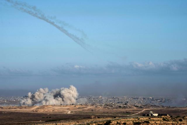 This picture taken from a position near Israel's border with the Gaza Strip, shows smoke billowing during an Israeli strike on the besieged territory on July 6, 2025. An Israeli delegation was expected in Doha on July 6 for talks on a Gaza truce and hostage release deal, ahead of a visit by Prime Minister Benjamin Netanyahu to the White House. (Photo by Maya Levin / AFP)