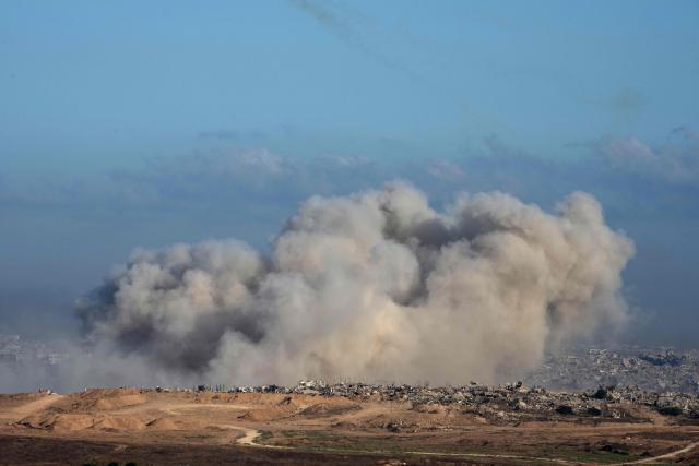 This picture taken from a position near Israel's border with the Gaza Strip, shows smoke billowing during an Israeli strike on the besieged territory on July 6, 2025. An Israeli delegation was expected in Doha on July 6 for talks on a Gaza truce and hostage release deal, ahead of a visit by Prime Minister Benjamin Netanyahu to the White House. (Photo by Maya Levin / AFP)