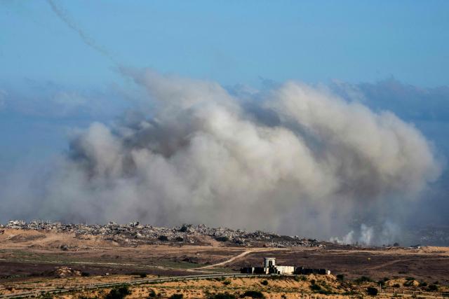 This picture taken from a position near Israel's border with the Gaza Strip, shows smoke billowing during an Israeli strike on the besieged territory on July 6, 2025. An Israeli delegation was expected in Doha on July 6 for talks on a Gaza truce and hostage release deal, ahead of a visit by Prime Minister Benjamin Netanyahu to the White House. (Photo by Maya Levin / AFP)