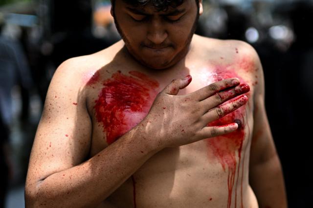 Shiite Muslims flagellate themselves during a religious procession marking Ashura, the tenth day of the Islamic holy month of Muharram, in Chennai on July 6, 2025. (Photo by R.Satish BABU / AFP)
