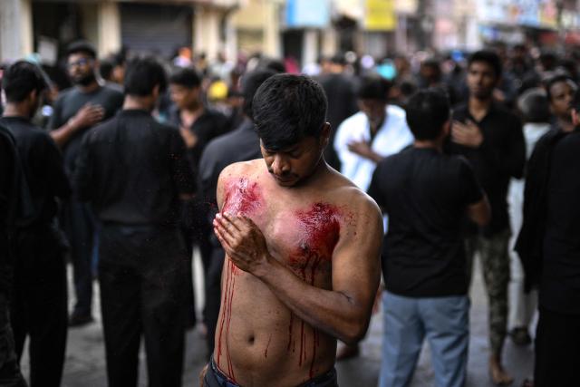 Shiite Muslims flagellate themselves during a religious procession marking Ashura, the tenth day of the Islamic holy month of Muharram, in Chennai on July 6, 2025. (Photo by R.Satish BABU / AFP)