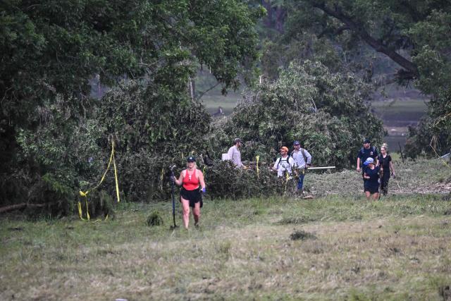 Volunteers look for missing people, following severe flash flooding that occured during the July 4 holiday weekend, in Hunt, Texas, on July 6, 2025. Rescuers in Texas raced against time Sunday to find dozens of missing people, including children, swept away by flash floods that killed at least 59, as forecasters warned of new deluges. Local Texans joined forces with disaster officials to search through the night for the missing, including 27 girls from a riverside Christian summer camp. Texas Governor Greg Abbott said Camp Mystic on the banks of the Guadalupe River, where some 750 girls had been staying when the floodwaters hit, had been "horrendously ravaged in ways unlike I've seen in any natural disaster." (Photo by RONALDO SCHEMIDT / AFP)