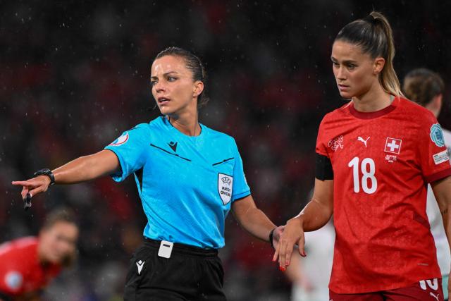Spanish referee Marta Huerta De Aza gestures as she hold the hand of Switzerland's defender #18 Viola Calligaris during the UEFA Women's Euro 2025 Group A football match between Switzerland and Iceland at the Wankdorf stadium in Bern, on July 6, 2025. (Photo by SEBASTIEN BOZON / AFP)