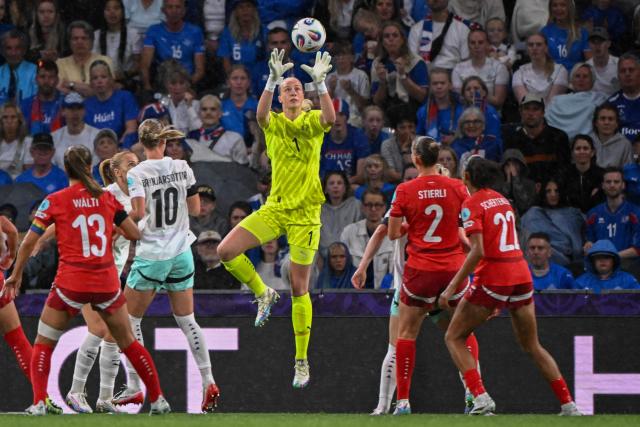 Iceland's goalkeeper #01 Cecilia Runarsdottir jumps for the ball during the UEFA Women's Euro 2025 Group A football match between Switzerland and Iceland at the Wankdorf stadium in Bern, on July 6, 2025. (Photo by SEBASTIEN BOZON / AFP)