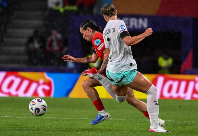 Switzerland's forward #06 Geraldine Reuteler and Iceland's defender #18 Gudrun Arnardottir fight for the ball during the UEFA Women's Euro 2025 Group A football match between Switzerland and Iceland at the Wankdorf stadium in Bern, on July 6, 2025. (Photo by SEBASTIEN BOZON / AFP)