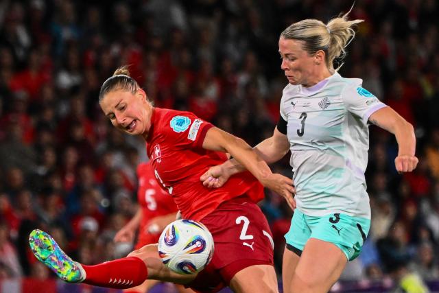 Switzerland's defender #02 Julia Stierli and Iceland's forward #03 Sandra Jessen fight for the ball during the UEFA Women's Euro 2025 Group A football match between Switzerland and Iceland at the Wankdorf stadium in Bern, on July 6, 2025. (Photo by SEBASTIEN BOZON / AFP)