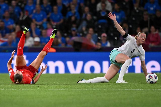 Switzerland's defender #05 Noelle Maritz and Iceland's forward #03 Sandra Jessen crash to the ground during the UEFA Women's Euro 2025 Group A football match between Switzerland and Iceland at the Wankdorf stadium in Bern, on July 6, 2025. (Photo by SEBASTIEN BOZON / AFP)