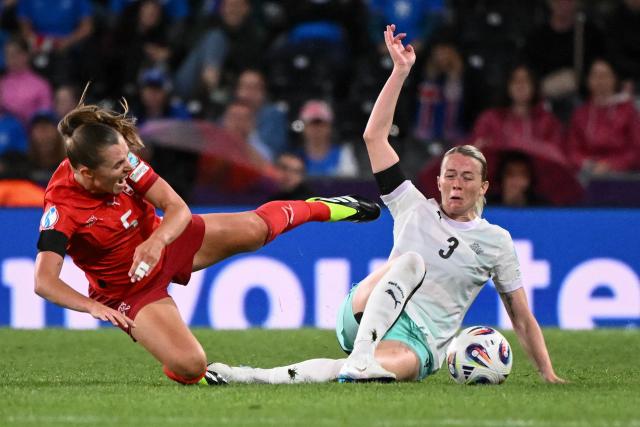 Switzerland's defender #05 Noelle Maritz and Iceland's forward #03 Sandra Jessen fight for the ball during the UEFA Women's Euro 2025 Group A football match between Switzerland and Iceland at the Wankdorf stadium in Bern, on July 6, 2025. (Photo by SEBASTIEN BOZON / AFP)