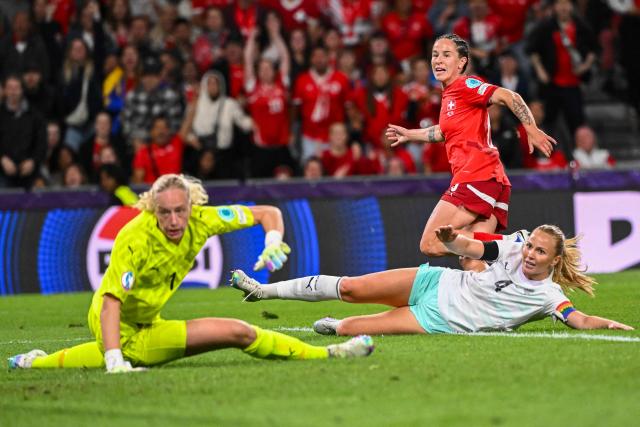 Switzerland's forward #06 Geraldine Reuteler (R - top) celebrates after she scored her teams's first goal during the UEFA Women's Euro 2025 Group A football match between Switzerland and Iceland at the Wankdorf stadium in Bern, on July 6, 2025. (Photo by SEBASTIEN BOZON / AFP)